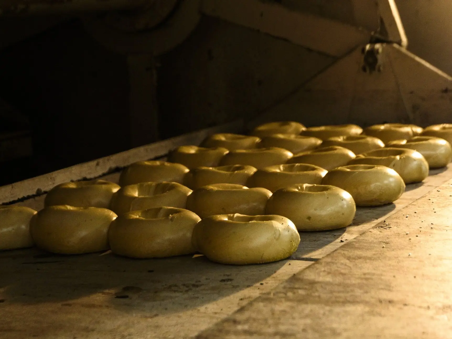 Bagels baking on the stone deck of the oven