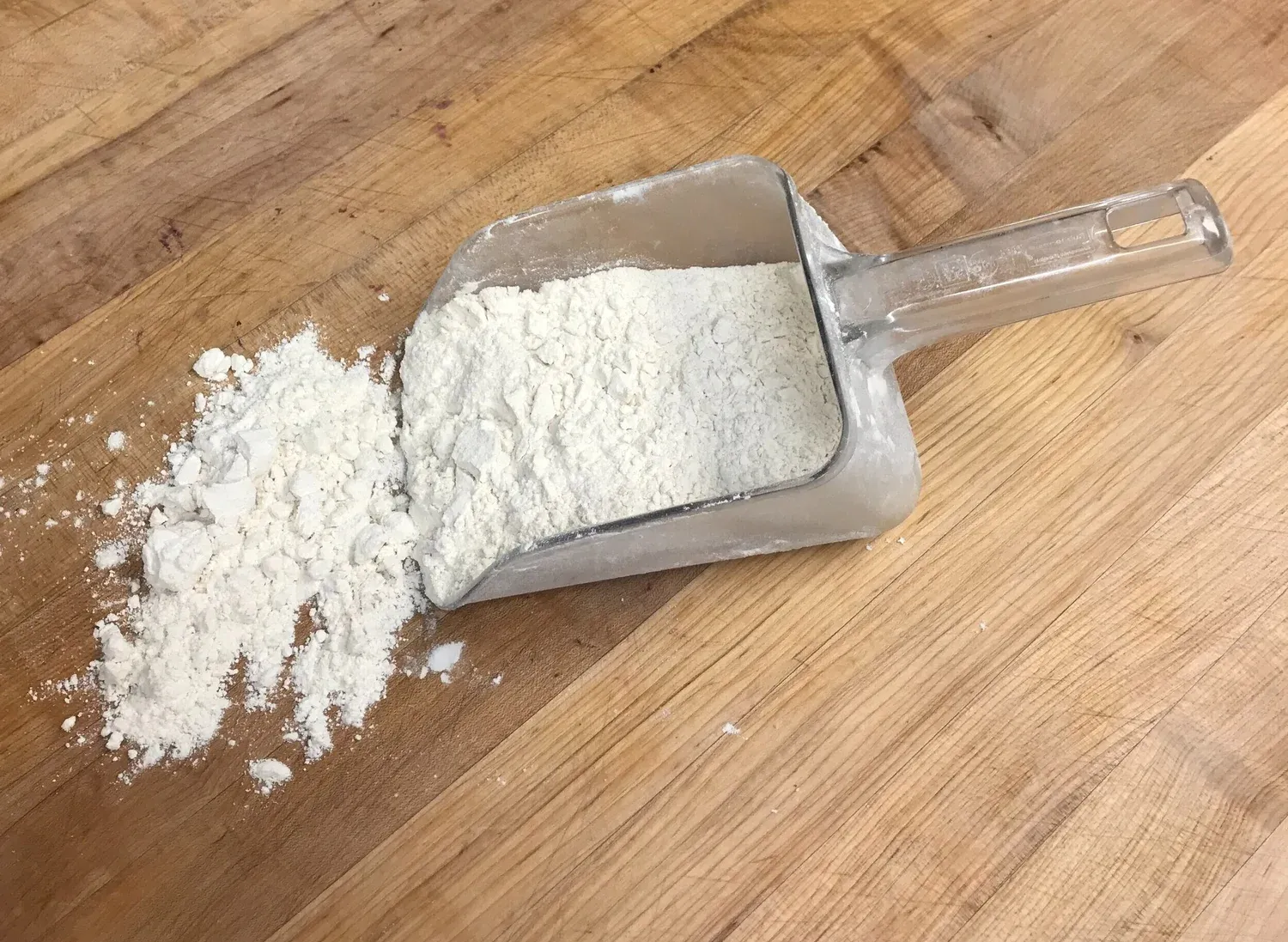 A scoop of flour on the table